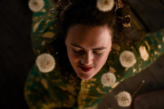 Kate Young with dandelions